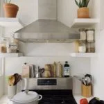 a kitchen with a stove and pots