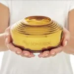 a person holding a jar