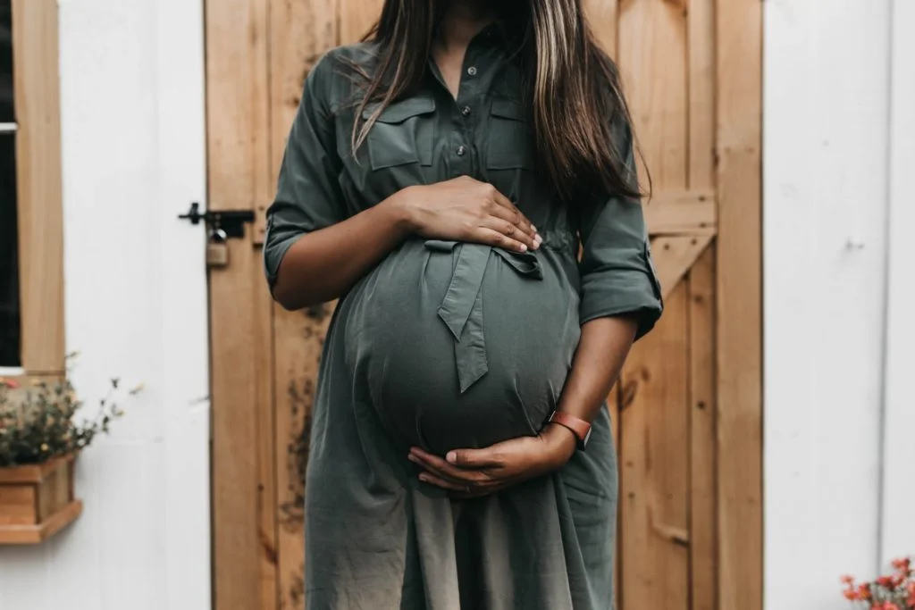 a woman holding her waist