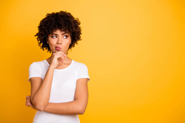 girl thinking about what to do with yellow background