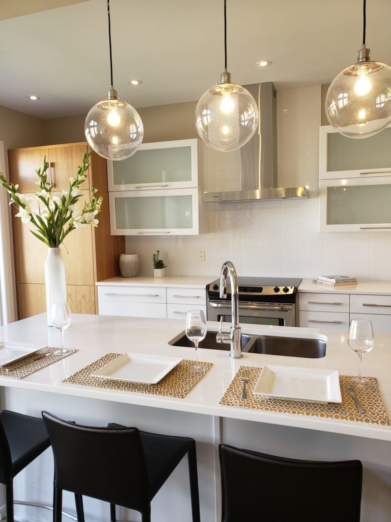 kitchen with modern details in white and wood wide shot