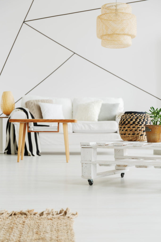 Wooden decoration in white cozy living room with stripes on wall