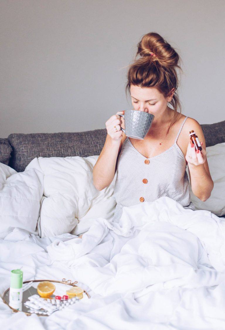 woman feeling seeking taking vitamins and fruit for self care