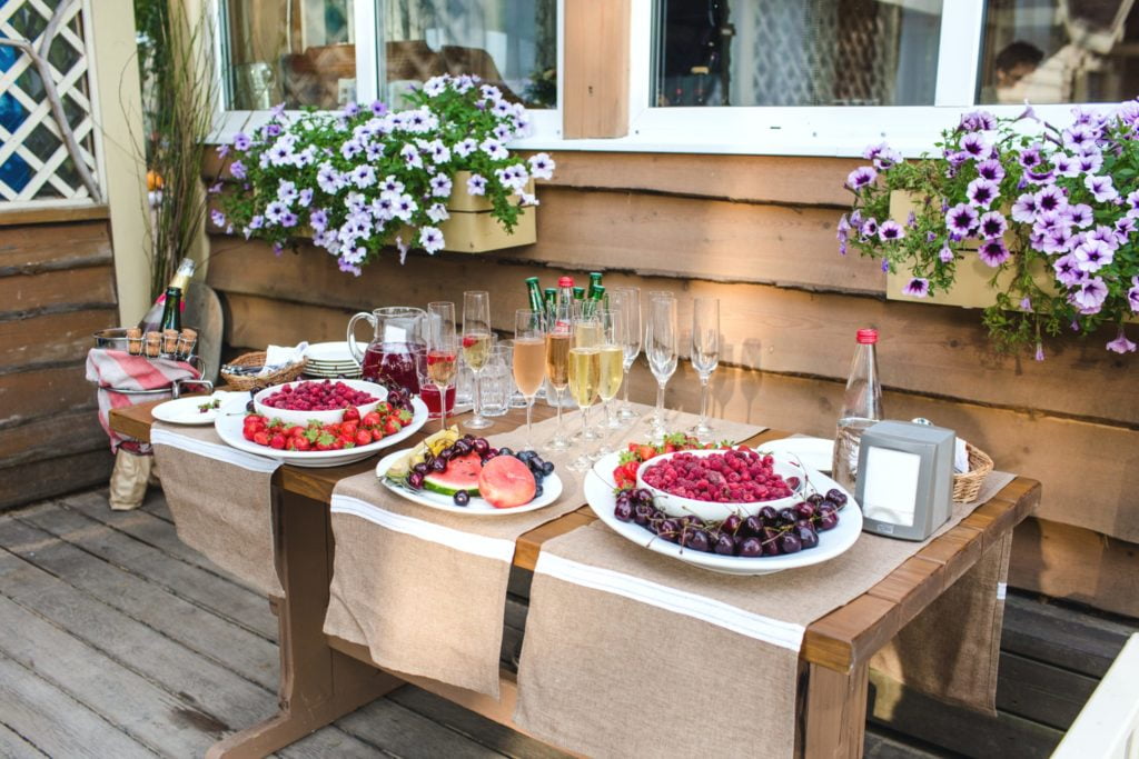 Party table full of fruits and flowers