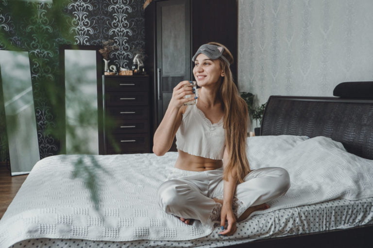 woman taking care of self with routine and vitamins